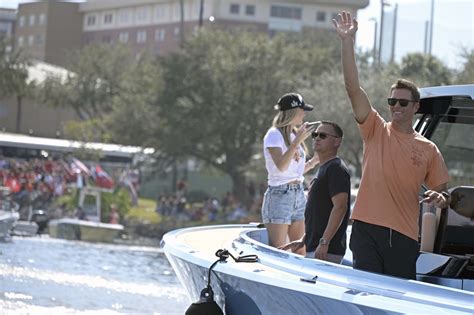 abc/tom brady tosses lombardi trophy to cameron brate in another boat during super bowl boat parade